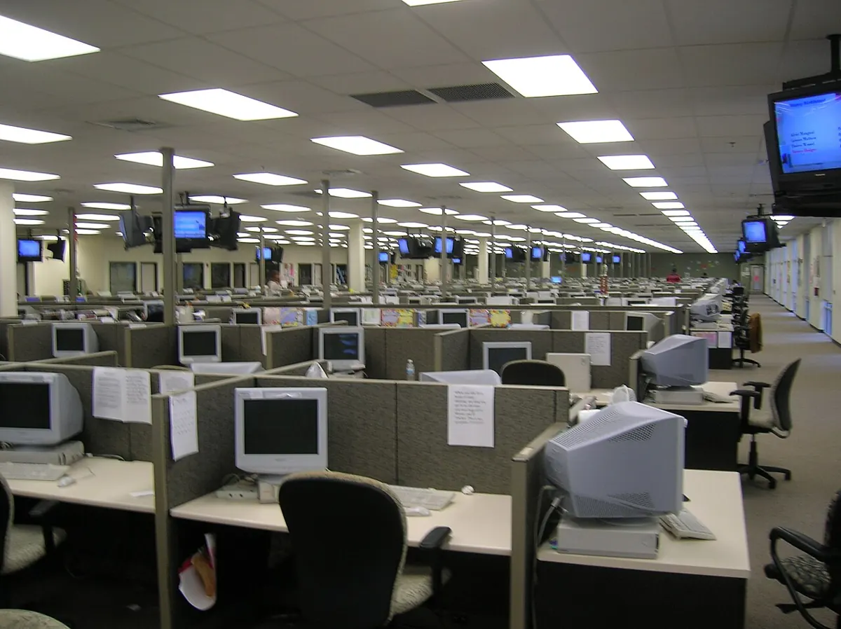 Call center agents with headsets working at computer stations in a modern BPO office in Cebu