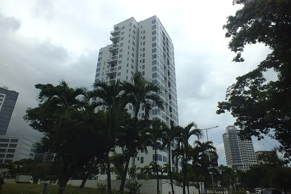Mid-rise condominium and apartment buildings in Cebu City with mountains in the background