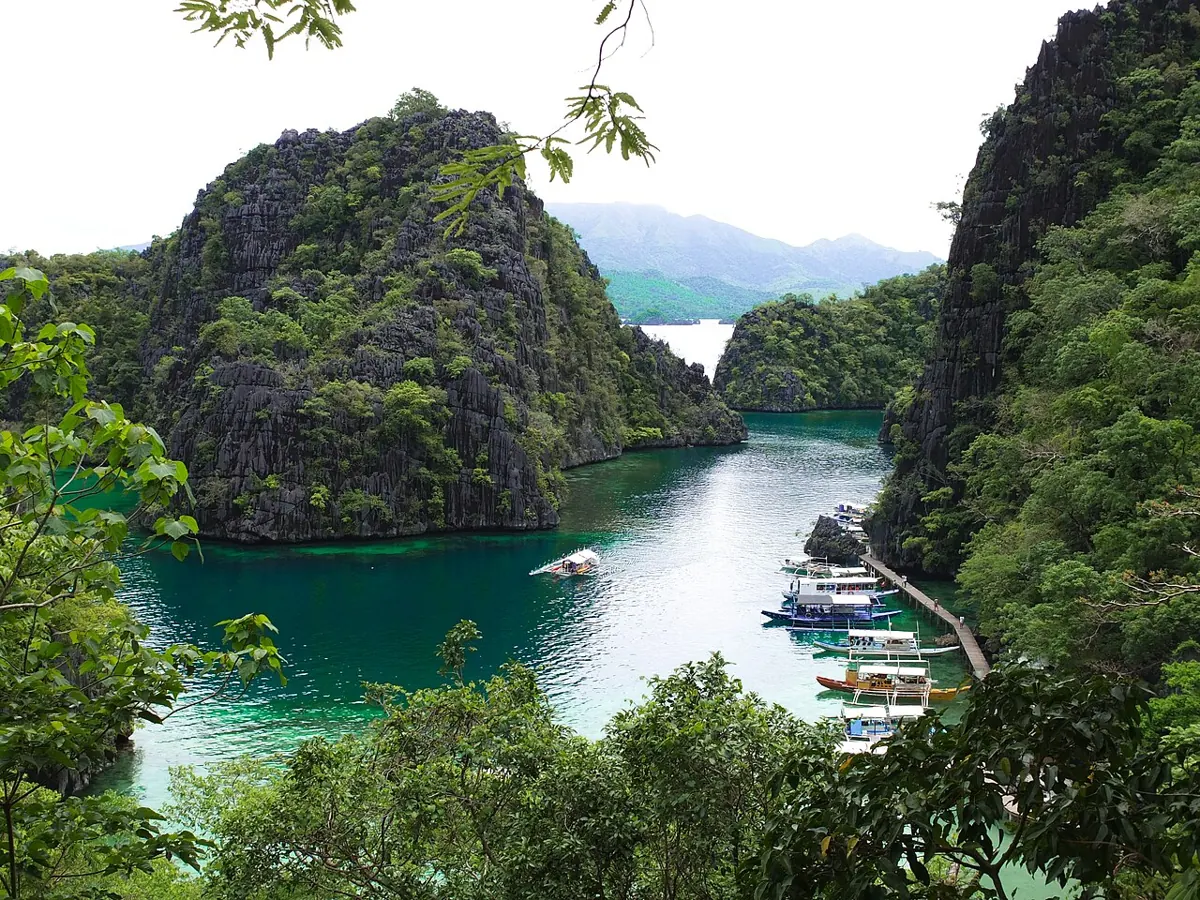 Turquoise lagoon framed by limestone cliffs in Coron, Palawan