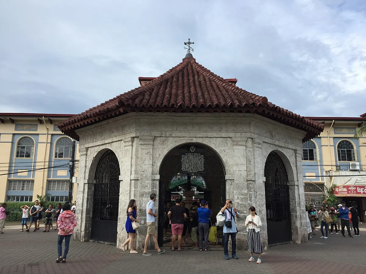 Magellan's Cross kiosk in Cebu City with its painted ceiling and wooden cross