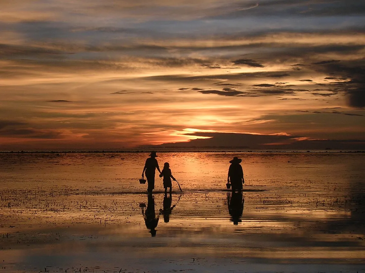Golden sunset over a calm beach in Cebu during the dry season